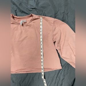 2 x crop style sweatshirts, one black one pink size medium woman